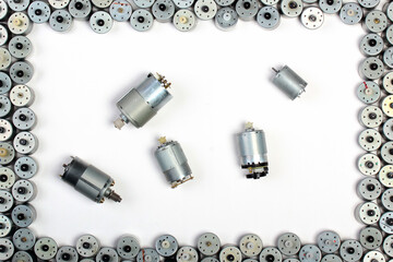 Small electrical motors on white table