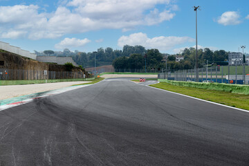 Skid marks on asphalt circuit motor sport straight track and turn