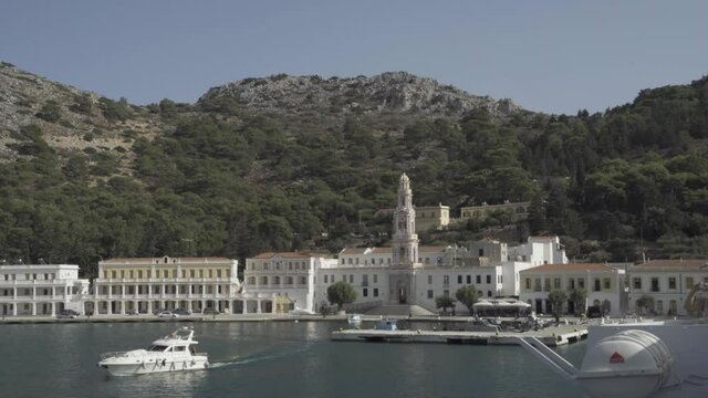 Symi island - Greece, September 25, 2020: Slow pan shot of Panormitis Monastery Dodecanese Island of Symi Simi near Alyki on the island of Thasos