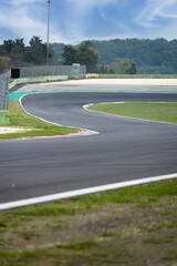 Going towards double turn on motorsport circuit asphalt track