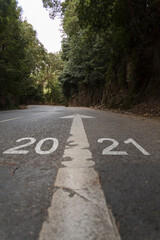 Road with the inscription 2021. Concept of new year arrival with new goals, sucess and future