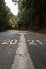 Obraz premium Road with the inscription 2021. Concept of new year arrival with new goals, sucess and future