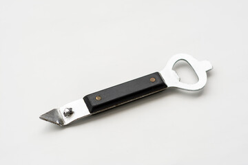 steel opener with a black handle on white