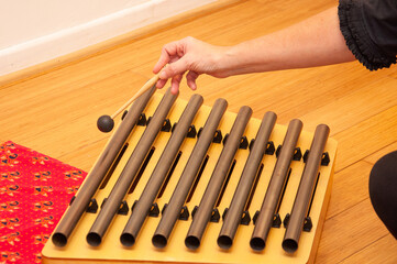 reiki session and sound harmonization with Tibetan bowls with hands giving relaxation to the woman in the zen space