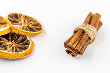 culinary decor dried orange and grapefruit with cinnamon stick on a white background