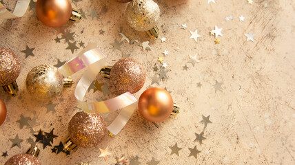 Christmas baubles with star shaped glitter and snow. Copy space.