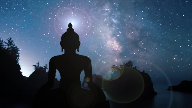 silhouette of buddha in night sky landscape