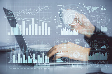 Double exposure of businesswoman hands typing on computer and forex graph hologram drawing. Financial analysis concept.