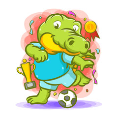 The crocodile kick the ball for the champion with the trophy near him