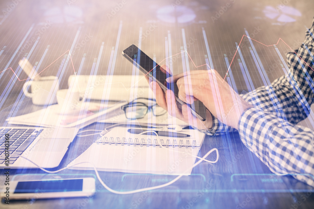 Poster double exposure of man's hands holding and using a digital device and forex graph drawing. financial
