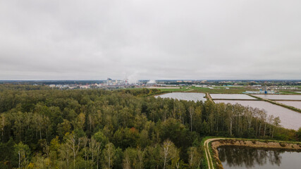 Sewage treatment plant. Garbage dump with treatment facilities near a small city, photo from a drone from a height. Ecological problem.