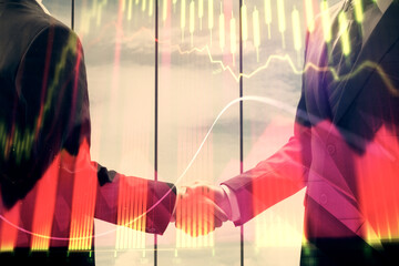 Fototapeta na wymiar Double exposure of forex graph hologram and handshake of two men. Stock market concept.