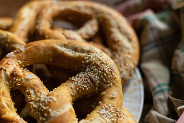 pattern culinary pretzel with sesame seeds, close-up snack for beer