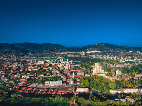 Aerial shot of the buildings under a blue sky in Zenica, Bosnia and Herzegovina