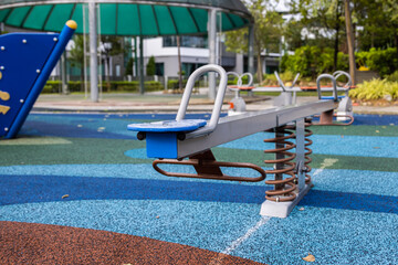 Abandoned swing in a playground. Playgrounds are blocked for use in the Corona Lock downs. Covid-19 also prohibits children from playing outdoors. An empty playground during the Corona crisis