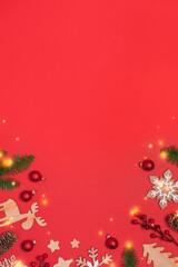 Christmas frame with decorations on red background