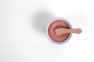 Chocolate Ice Cream Cups with spoon isolated on white background. Top view