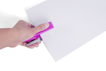 Hand holding pink stapler To staple white paper isolated on a white background. Besides of tool picture.
