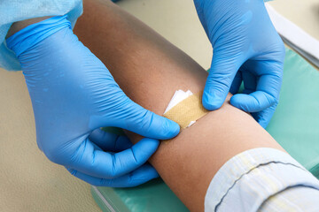 Nurse taking blood sample to make a test in laboratory