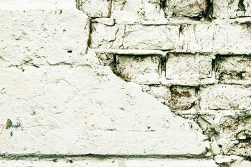 Empty old brick walls texture close-up. Painted problem wall surfaces. Grunge Red Stone Background. Worn facade of the building with damaged plaster. Abstract web banner.