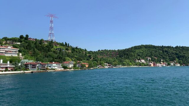 Footage of Anadolu hisari / Kandilli area of Istanbul by Bosphorus. Beautiful scene. It is a sunny summer day. Camera moves forward.