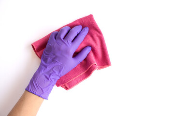 Hand holding pink duster microfiber cloth for cleaning isolated on white background with clipping path.