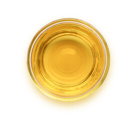 Olive oil or cooking oil in glass bowl isolated on white background with clipping path. Top view. Flat lay.