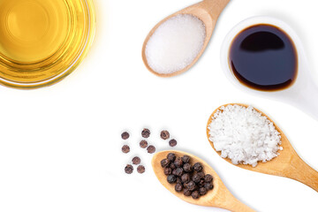 Cooking oil or olive oil with seasoning isolated on white background. Cooking preparation concept. Top view, Flat lay.