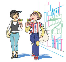 クレープを食べながら歩く女性2人組