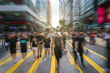 Blurred Crowd Unrecognizable Pedestrians walking and traffic car over the crosswalk in Mong Kok area, Hong Kong,Famous market of shopping center at afternoon, blur business and people concept