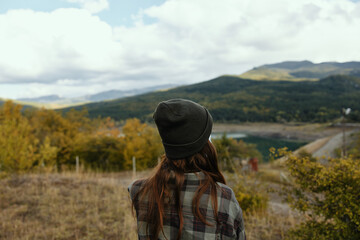 Woman on a meadow in the mountains dry grass nature fresh air