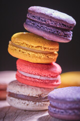 colorful macaroons on wooden table