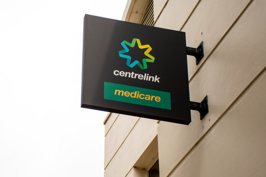 Sydney, Australia - 2019-12-24 Medicare And Centrlink Sign Outside Of A Building. Centrelink Is An Australian Government Agency That Administers Medicare And Disability Insurance Scheme.