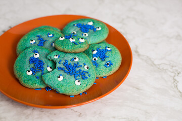 Orange plate of Blue Monster cookies