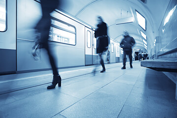 crowd of people metro in motion blurred, abstract background urban traffic people