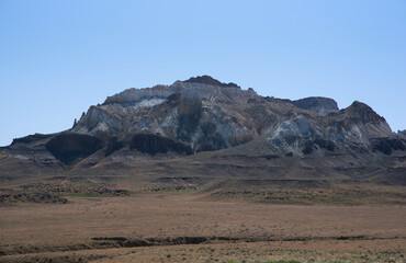Desert background landscape. Stunning sandstone layered rock formations. Jordanian desert of Wadi Rum in Jordan. Wadi Rum is known as the Valley of the Moon and the UNESCO World Heritage List.