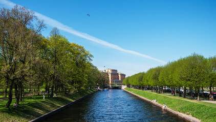 Fototapeta premium Summer or spring park canal pond landscape. Streets and canals in the historical center of Saint Petersburg, Russia.