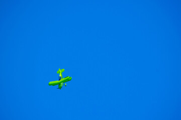 A small sutunt plane doing tricks in the sky of guatemala