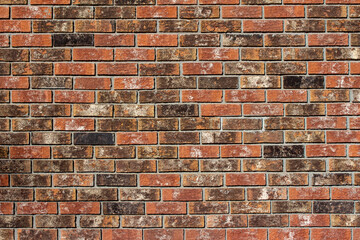 Full frame texture background of an exterior clay brick wall with textured bricks in beautiful fiery red, white and brown hues