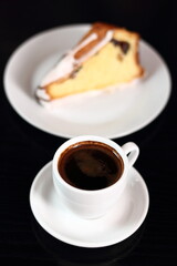 Coffee cup and cake with sugar icing