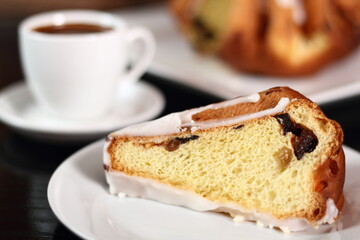 Cake with sugar icing and coffee cup