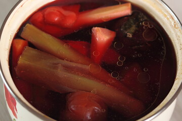 Boiled vegetables in saucepot. Making soup.