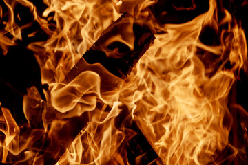 Beautiful fire burning in fireplace full of wood fire flame