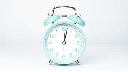 Blue Alarm clock Twelve o'clock isolated on white background..