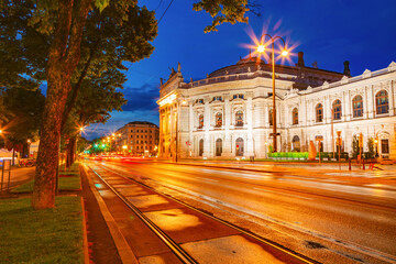 Fototapeta na wymiar The famous historic Burgtheater in evening time. Austrian National Theatre in Vienna is tourist attraction.