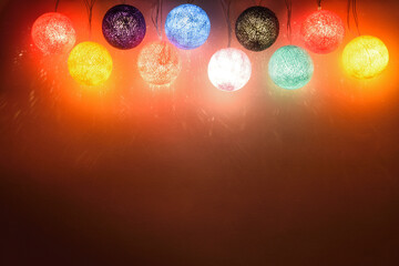 New Year's electric garland of balls hanging on the wall