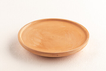 Beige wooden plate isolated on the white