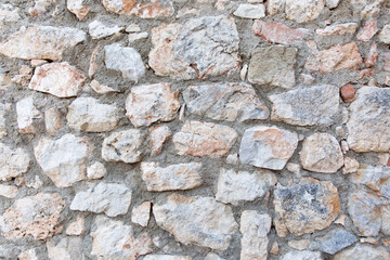 Antique stone wall. Old gray bricks background.