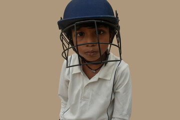 Portrait of boy wearing cricket helmet