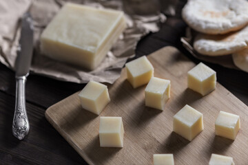 Halloumi cheese cut into square pieces. Country style.